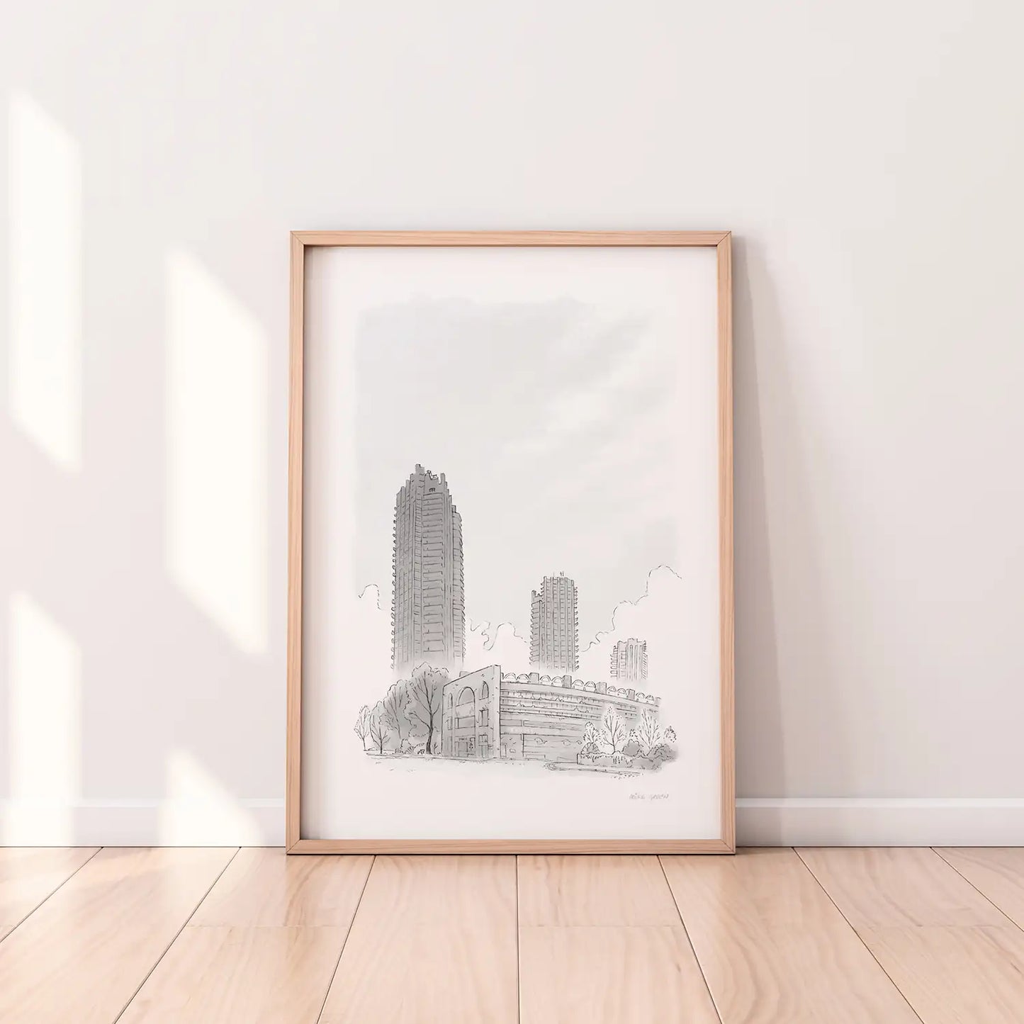 A framed print of London's Barbican Towers sketched by Mike Green Illustration