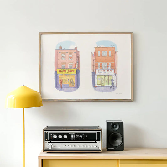 Framed art print of an illustration of the two famous Beigel shops on Brick Lane in London above a stereo