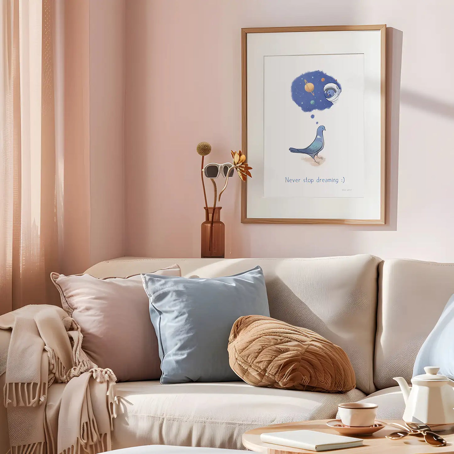 Framed print of a pigeon dreaming about going into space with the text 'never stop dreaming' on a living room wall.