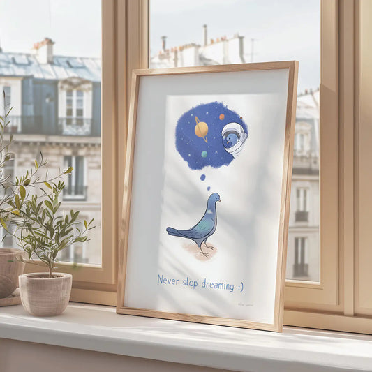 Framed print of a pigeon dreaming about going into space with the text 'never stop dreaming' on a window sill in Paris