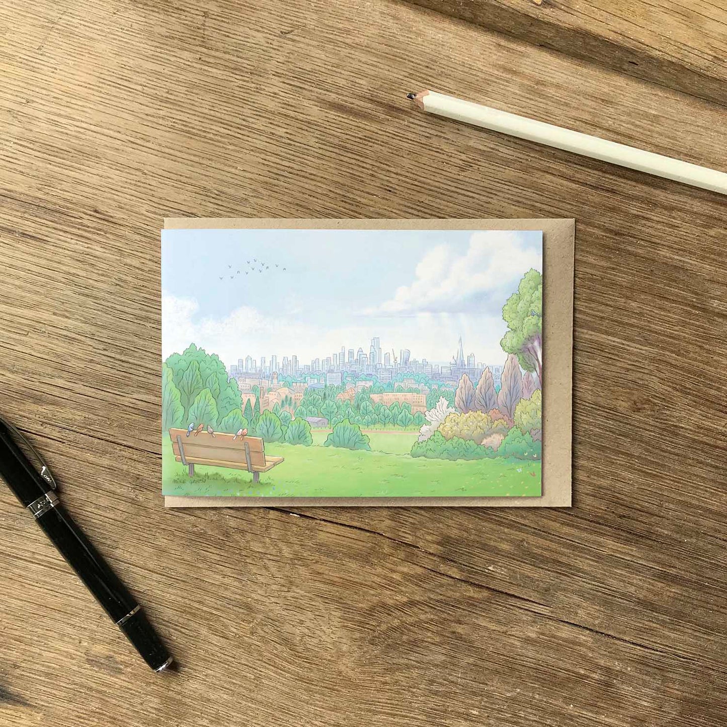 View from Londons Parliament Hill in Hampstead Heath beautifully illustrated on a greeting card by mike green illustration.