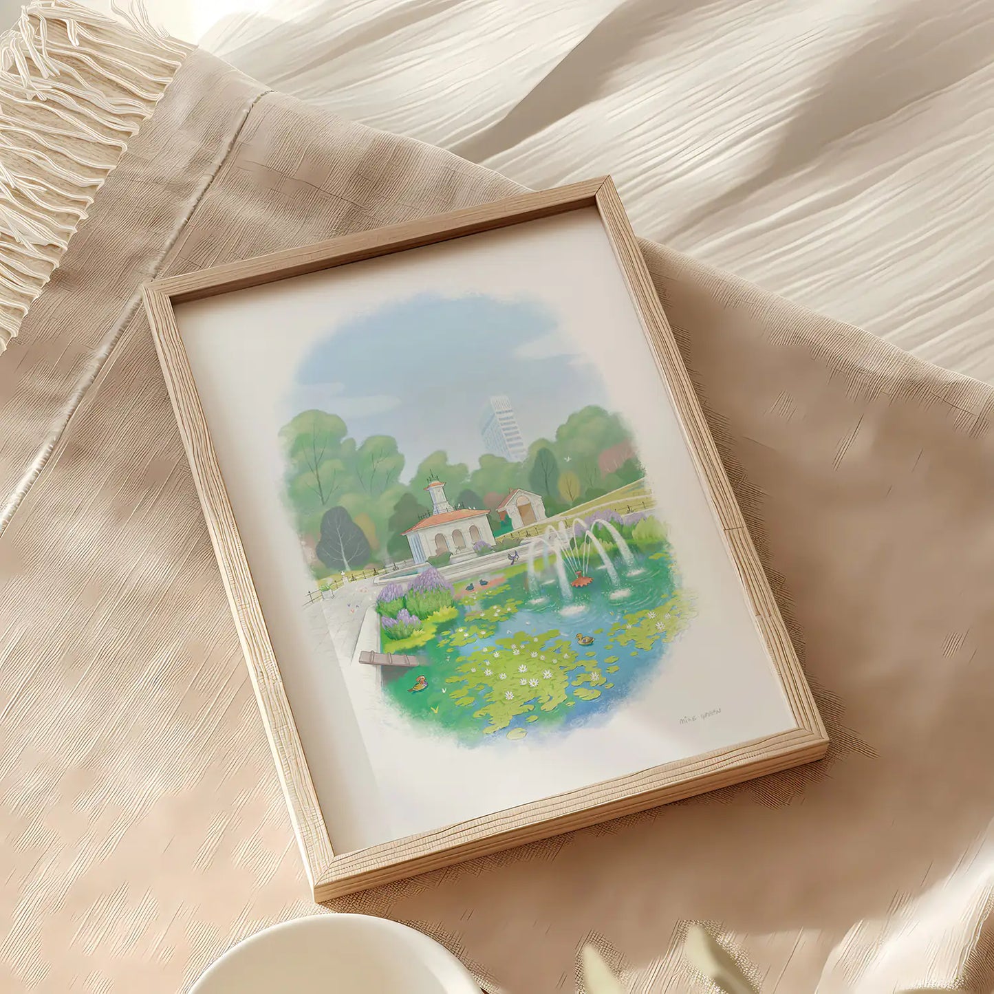Framed painting of Hyde Park's Italian Garden resting on fabric