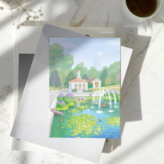 Greetings card with painting of the Italian Gardens in London's Hyde Park on pile of books on a marble table
