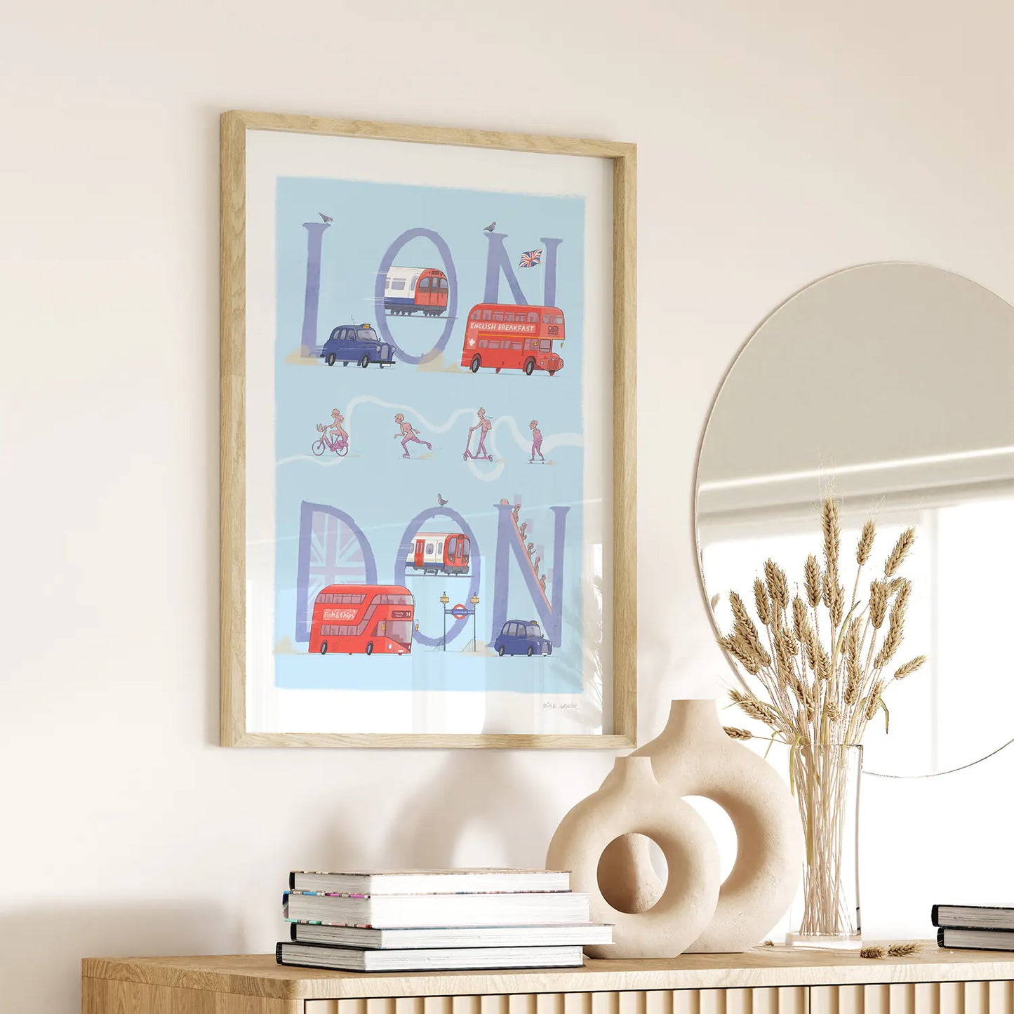 Framed print of a painting of London's transport including busses, taxi's and underground trains.