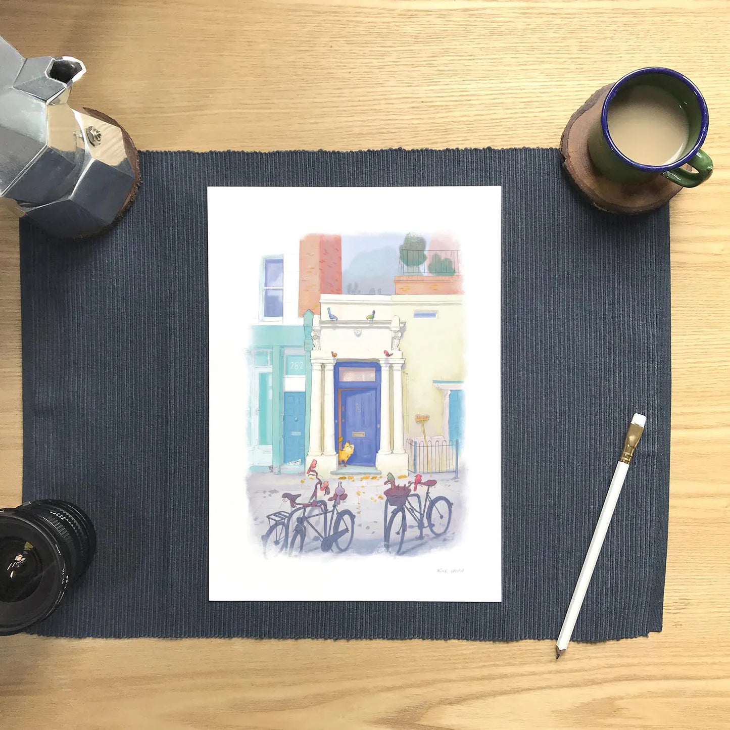Wall art print of a painting of the blue door in London's Notting Hill with a cat watched by a few local birds on bicycles