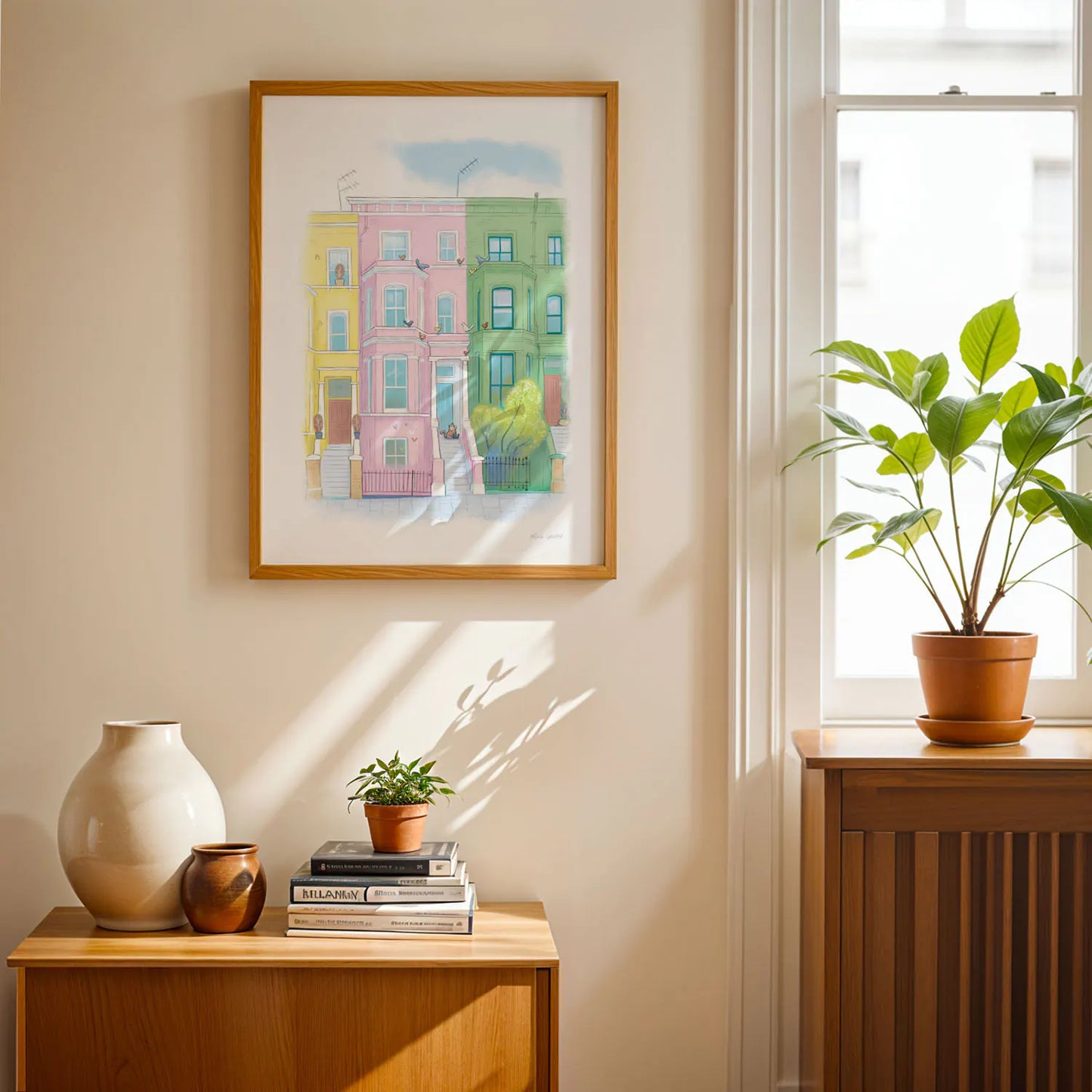 Framed art print of colourful houses in London's Notting Hill with a lazy at on the doorstop by Mike Green Illustration