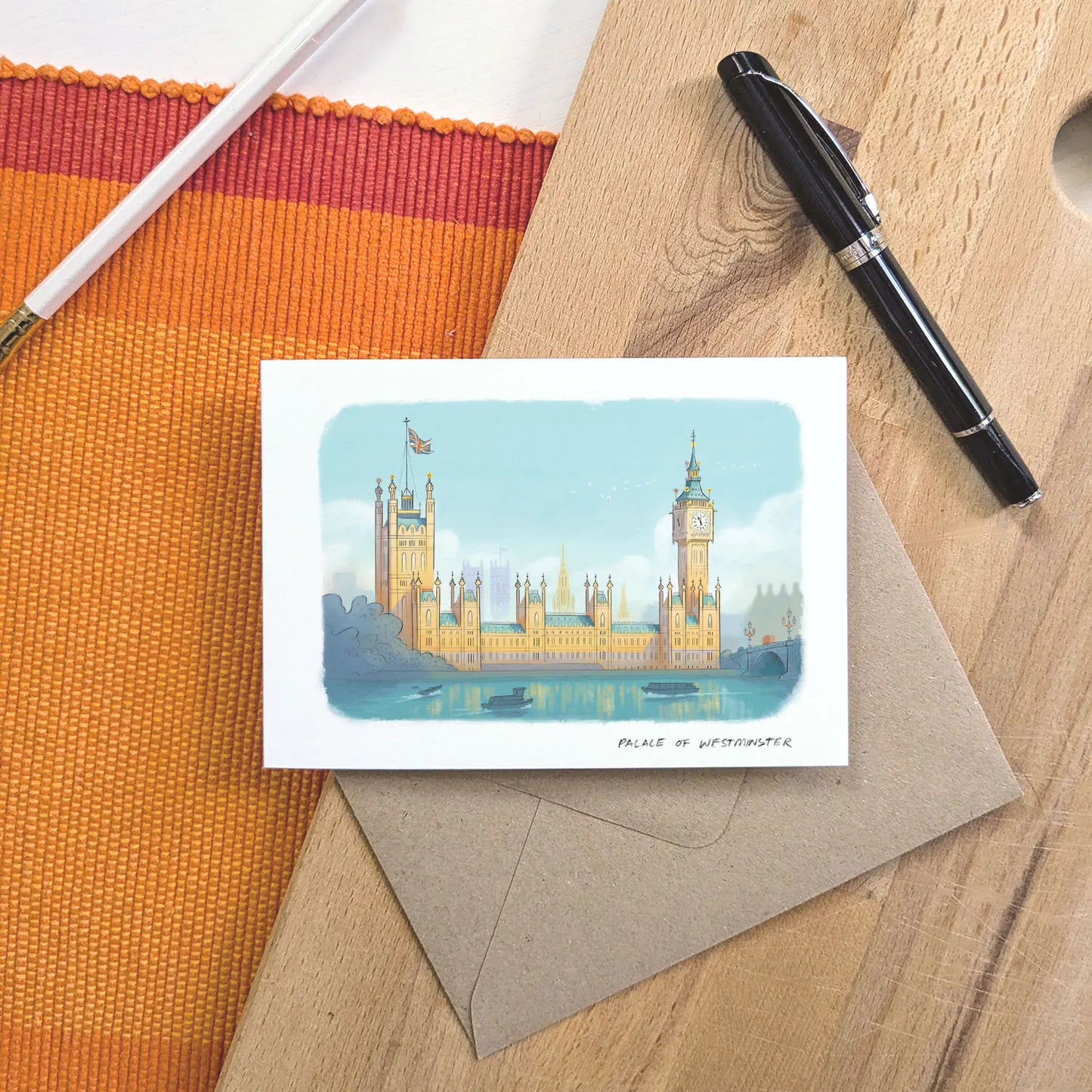 Greetings card with illustration of London's Palace of Westminster including Big Ben with a pen