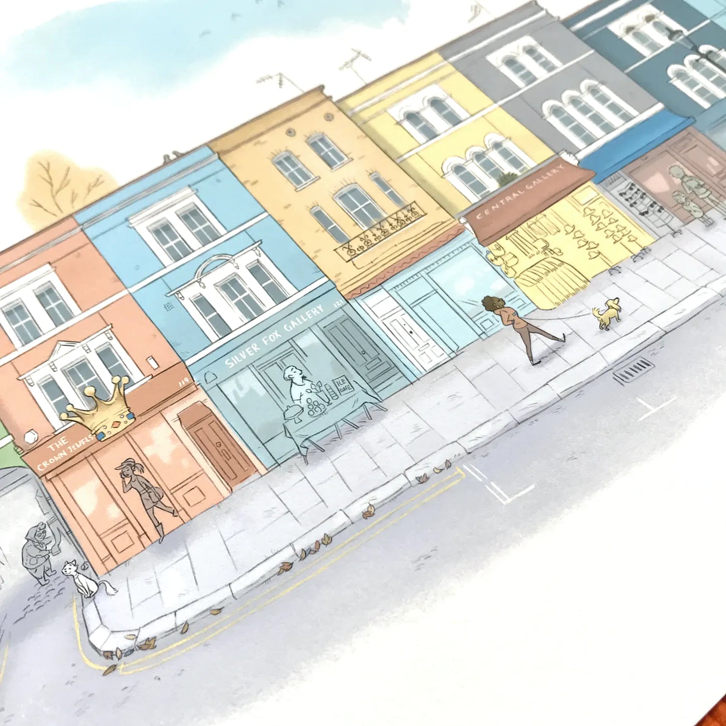 Photo of a wall art print of a painting of shops on Portobello Road in London's Notting Hill