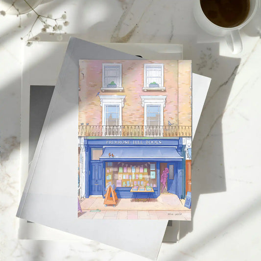 Greetings card on marble table with an illustration of London's Primrose Hill Books shop