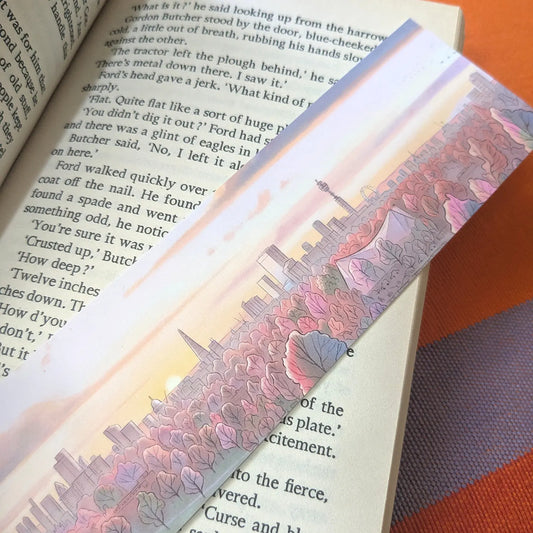Bookmark with illustration of the view from primrose hill in London with a sunset resting on a book