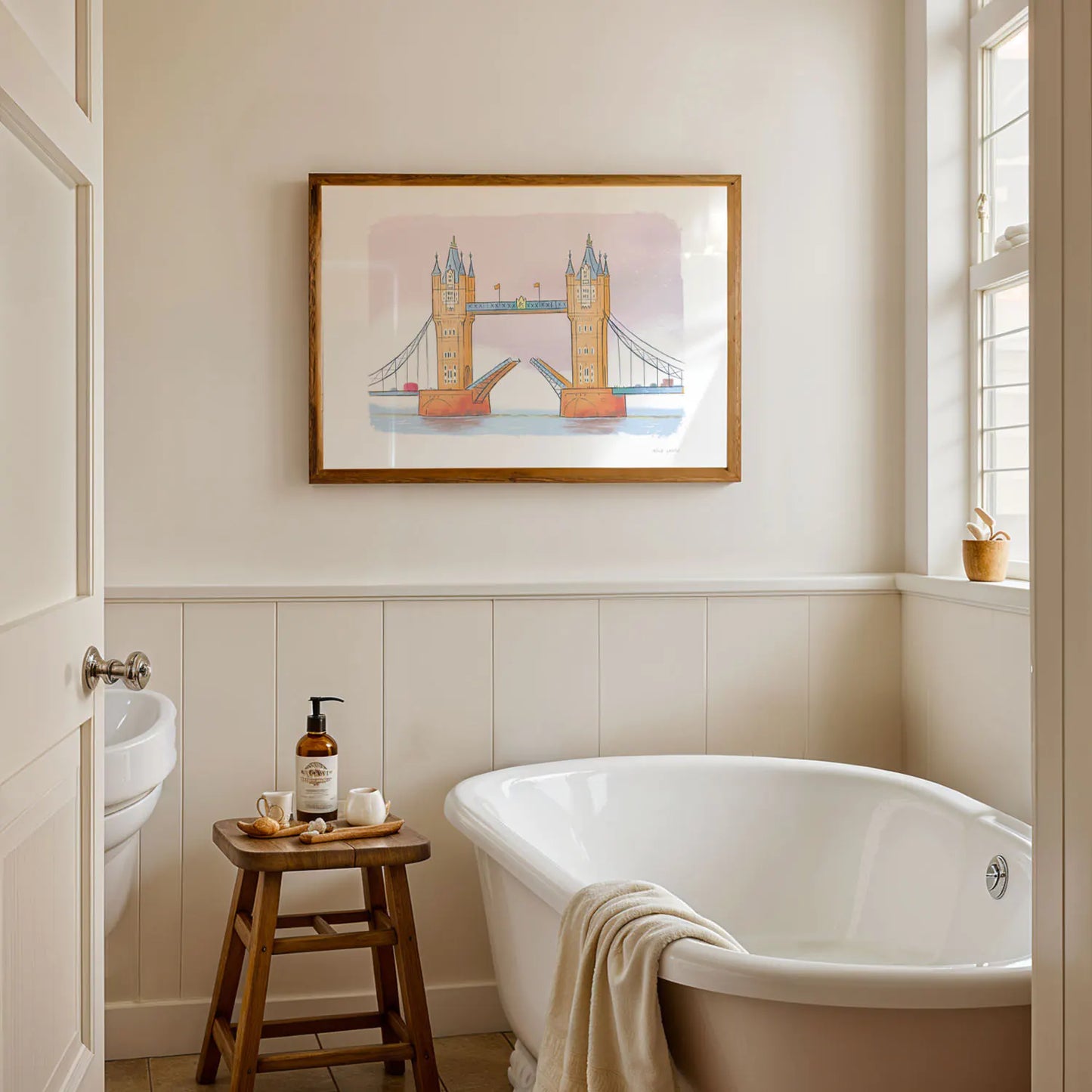 An art print of London's Tower Bridge painted by Mike Green Illustration framed in a bathroom