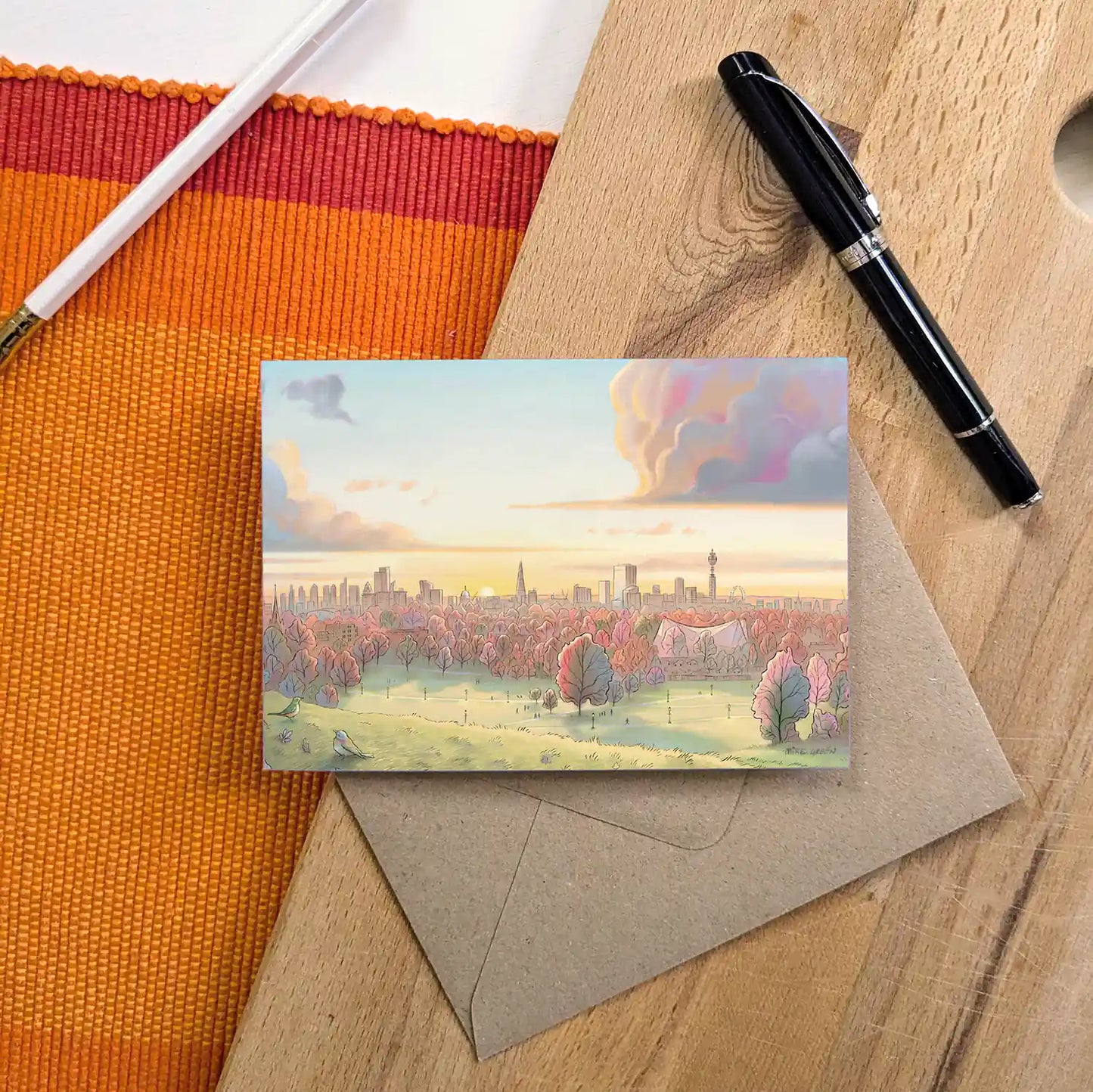 View from Primrose Hill in at sunrise in the Autumn on a greetings card by Mike Green Illustration