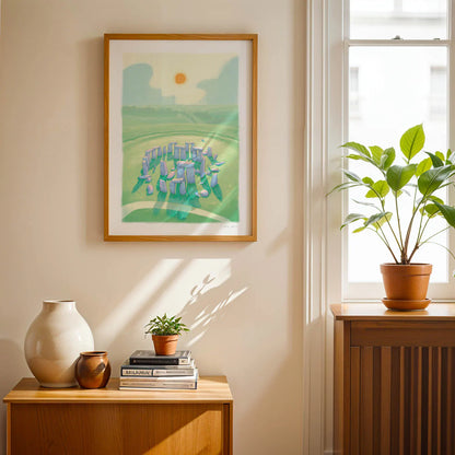 Framed wall art print of a painting of Stonehenge in Wiltshire England in a room with a plant