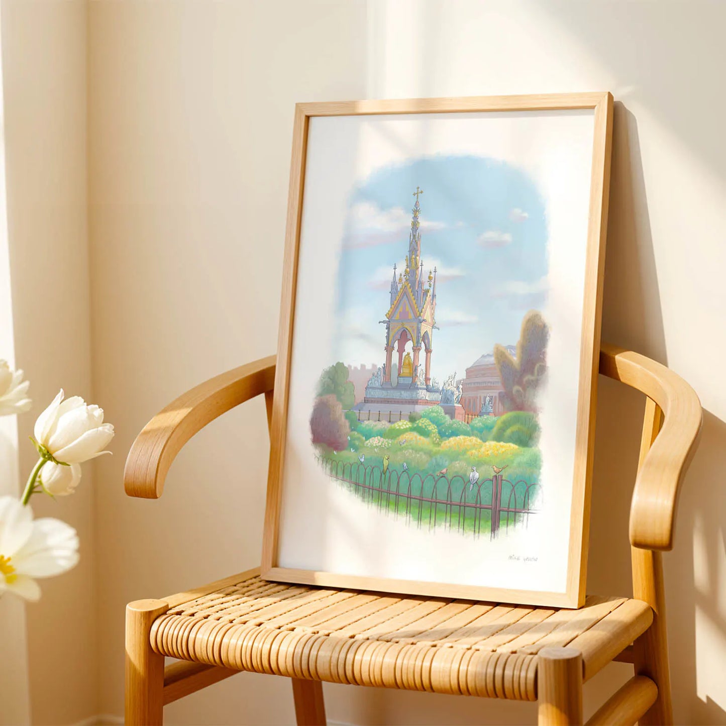 Framed wall art print of a painting of the Albert Memorial in London Hyde Park on a wooden chair
