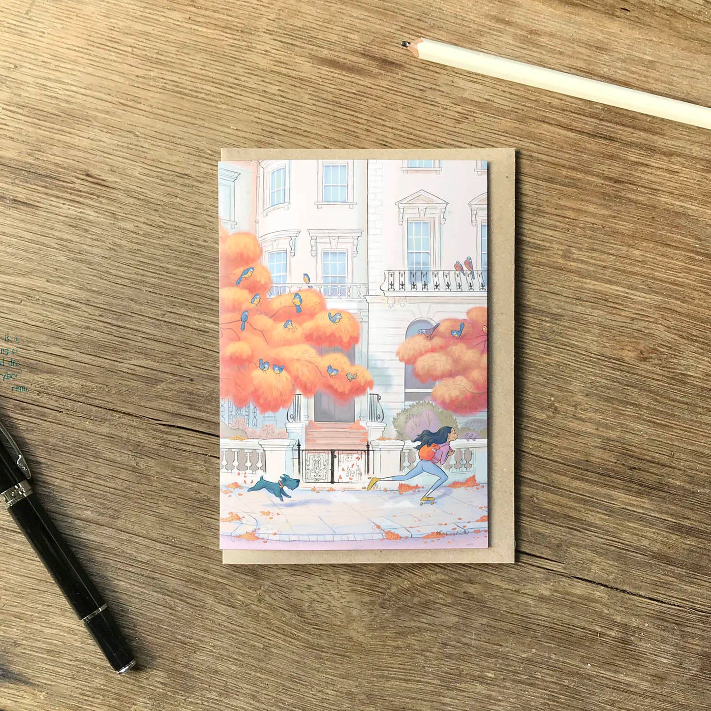 Greetings card and envelope with painting of lady skating in London's Notting Hill in the Autumn with her dog