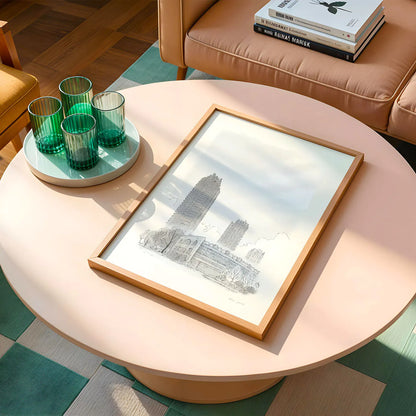 A fine art print of London's Barbican Towers sketched by Mike Green Illustration on a round table