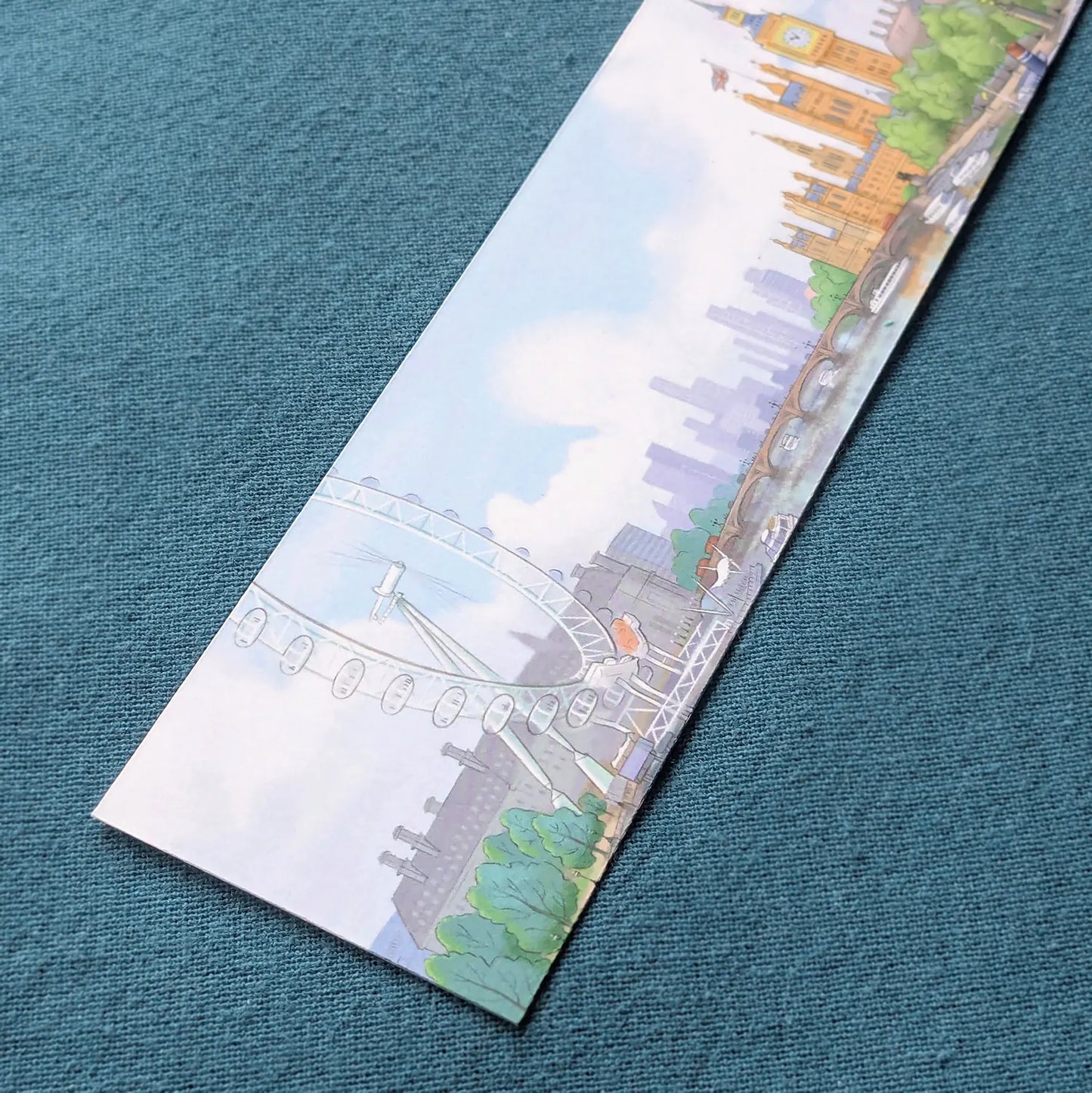 Close up of a bookmark with a painting of Big Ben and the London Eye on some cloth