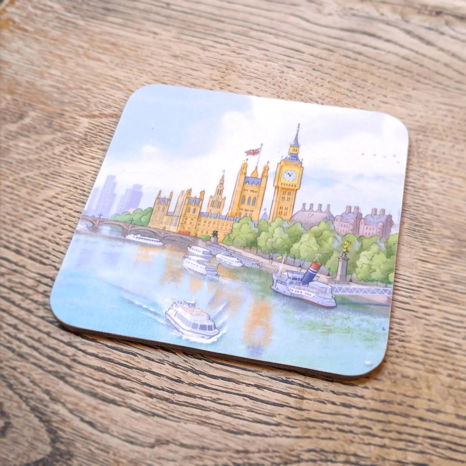 Melamine and cork coaster with painting of London's Palace of Westminster and Big Ben with boats on the river Thames in London