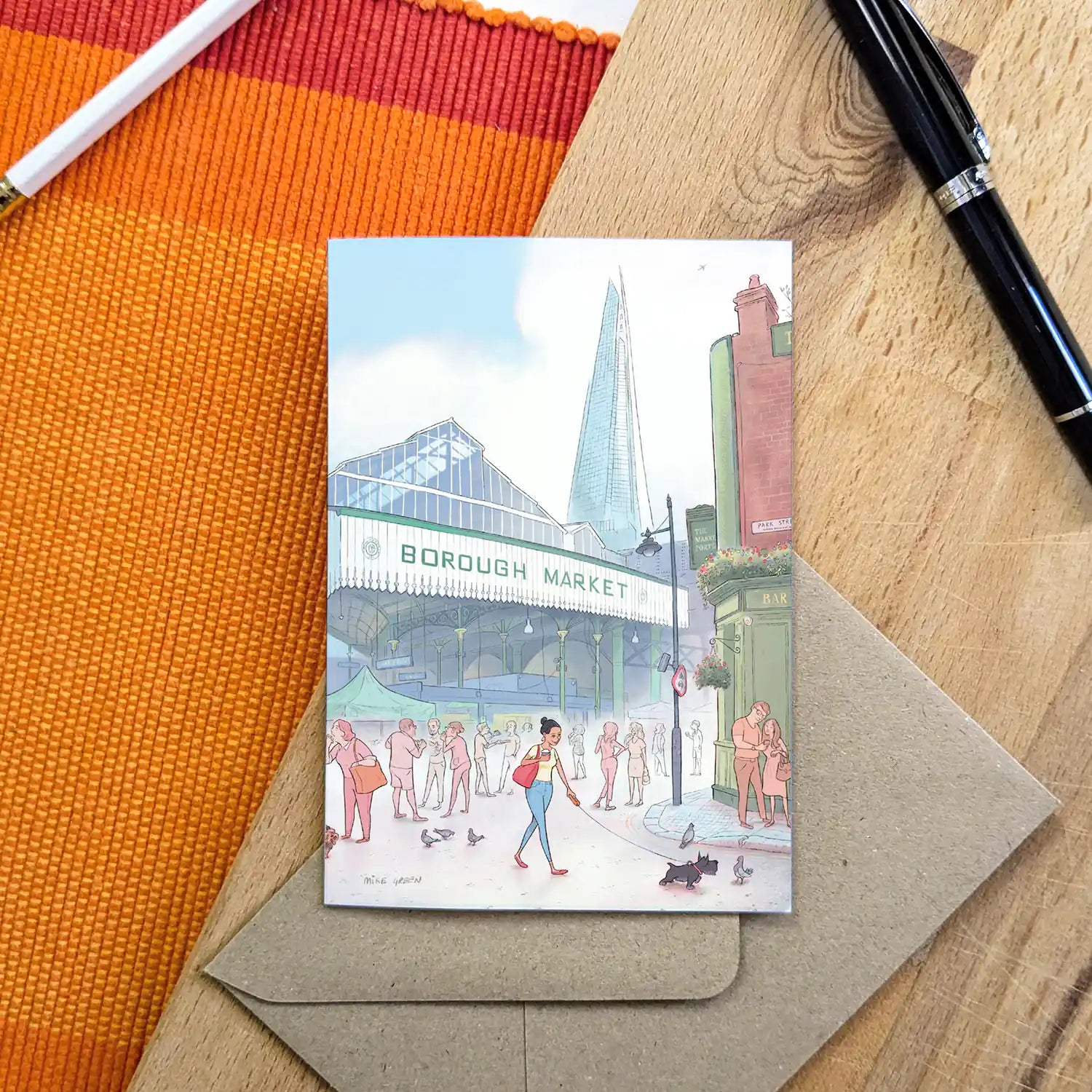 A lady and her dog in London's Borough Market beautifully illustrated on a greeting card by mike green illustration.