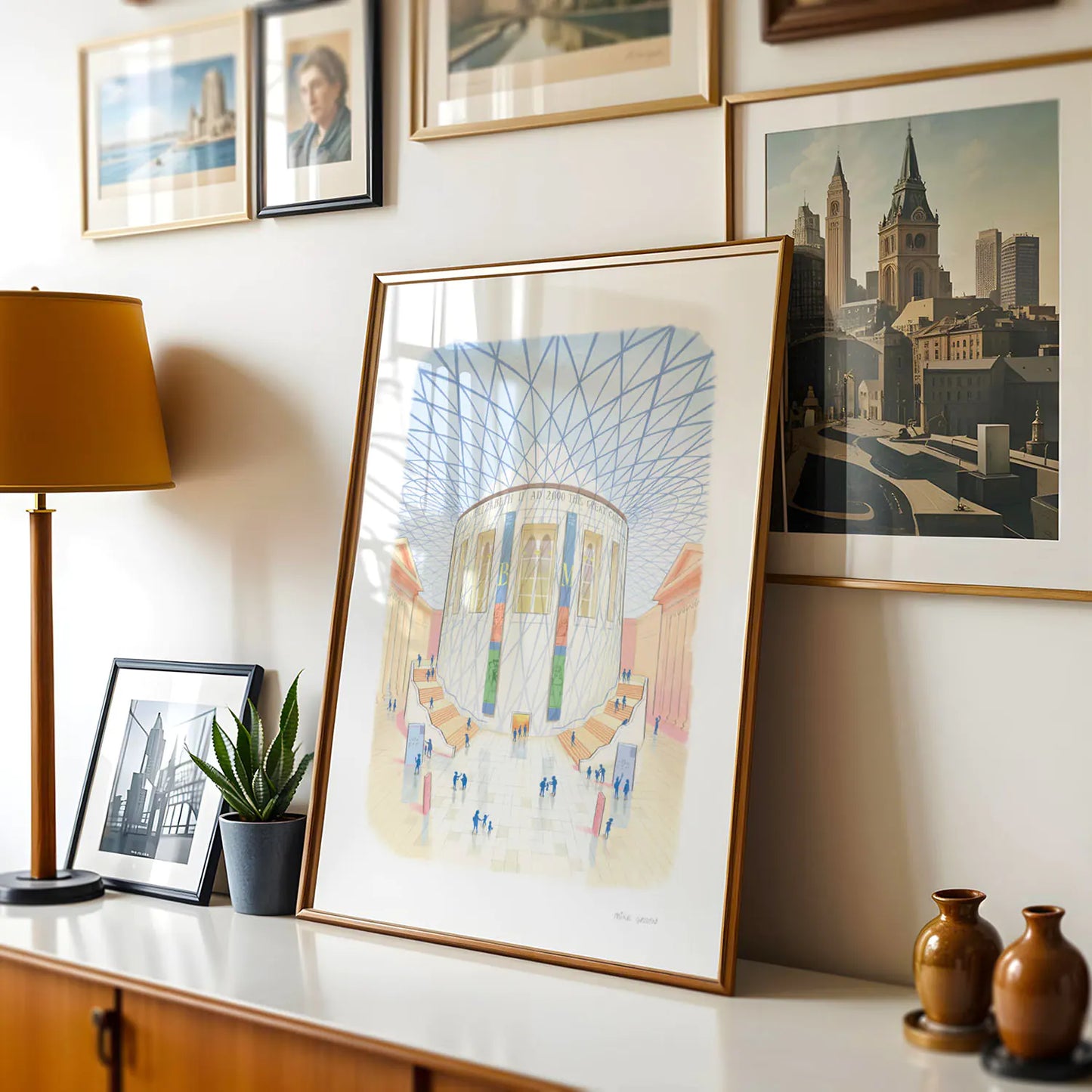 Framed wall art print of the British Museum great court in London on a cabinet with lamp
