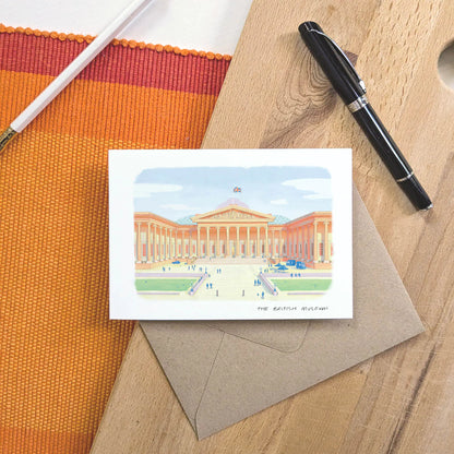 Greetings card of The British Museum in London with an envelope, pen and pencil