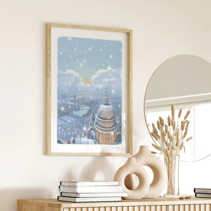 Wall art print of St Paul's Cathedral and London skyline in the evening with falling snow on a wall in a hallway