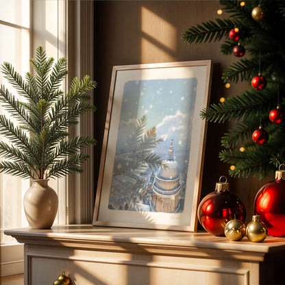 Framed wall art print of St Paul's Cathedral and London skyline in the evening with falling snow on a chest of drawers with Christmas decorations