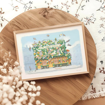 Wall art print of a painting of The Churchill Arms pub in Kensington London framed on a round table