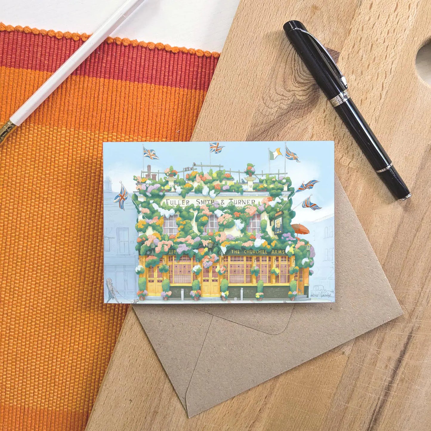 Greetings card of a painting of The Churchill Arms pub in west London's Kensington near Notting Hill with an envelope