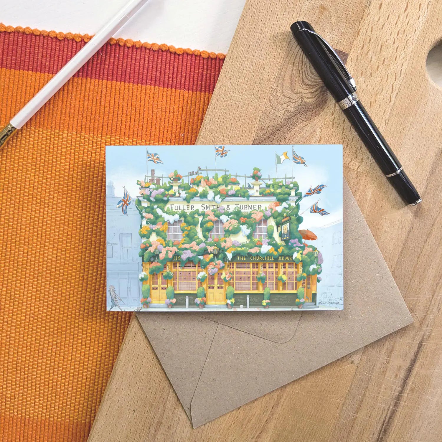 Greetings card of a painting of The Churchill Arms pub in west London's Kensington near Notting Hill with an envelope