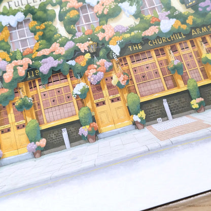 Photo of a wall art print painting of The Churchill Arms pub in Kensington west London