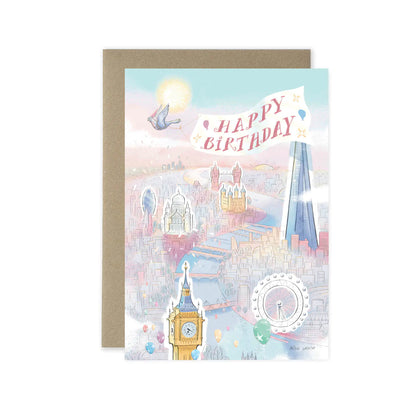 London birthday greetings card featuring a pigeon and big ben in a sunny city scape with Happy Birthday text and a brown envelope on a white background