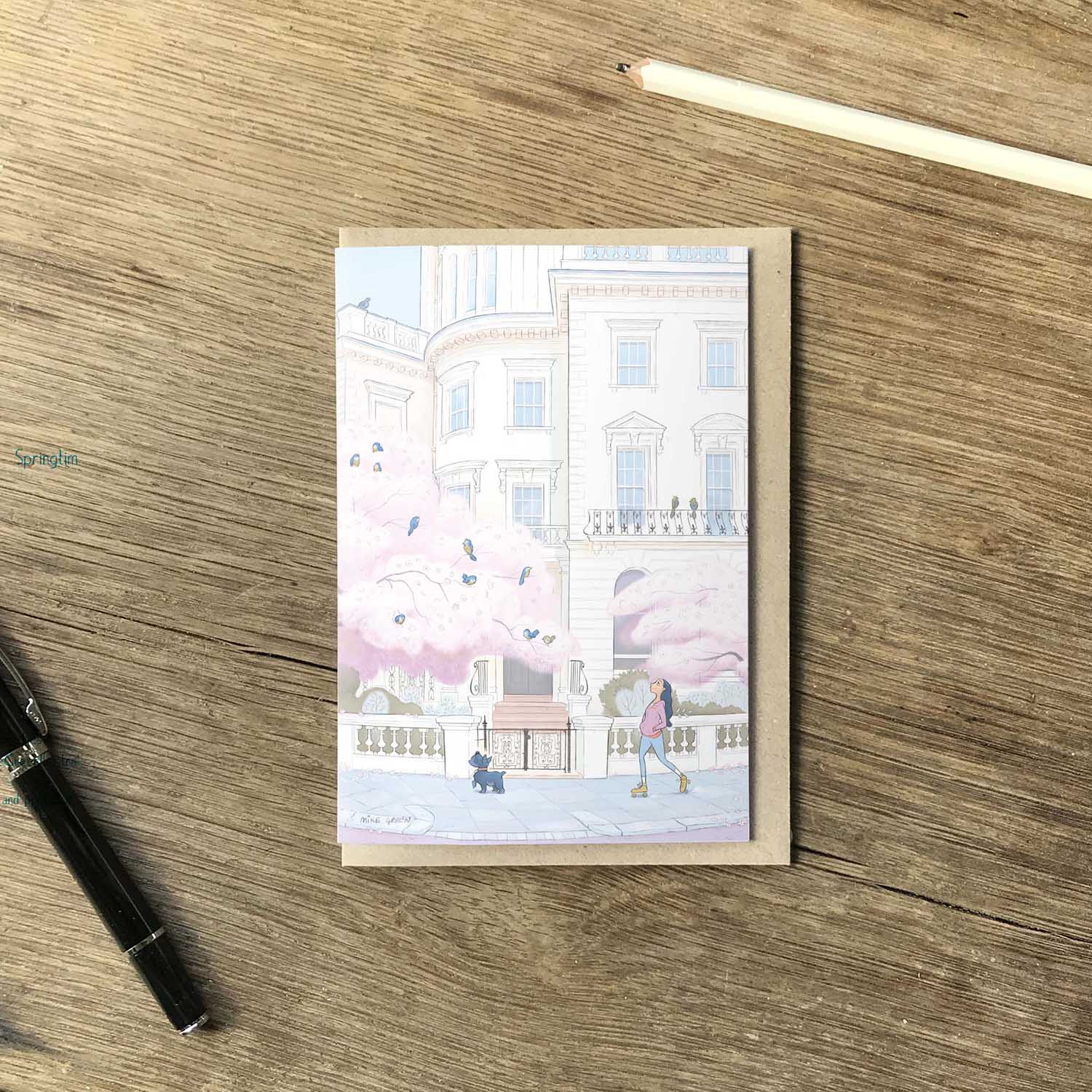 A lady and her dog skates through londons Kensington in the spring in this beautifully illustrated greeting card by mike green illustration.