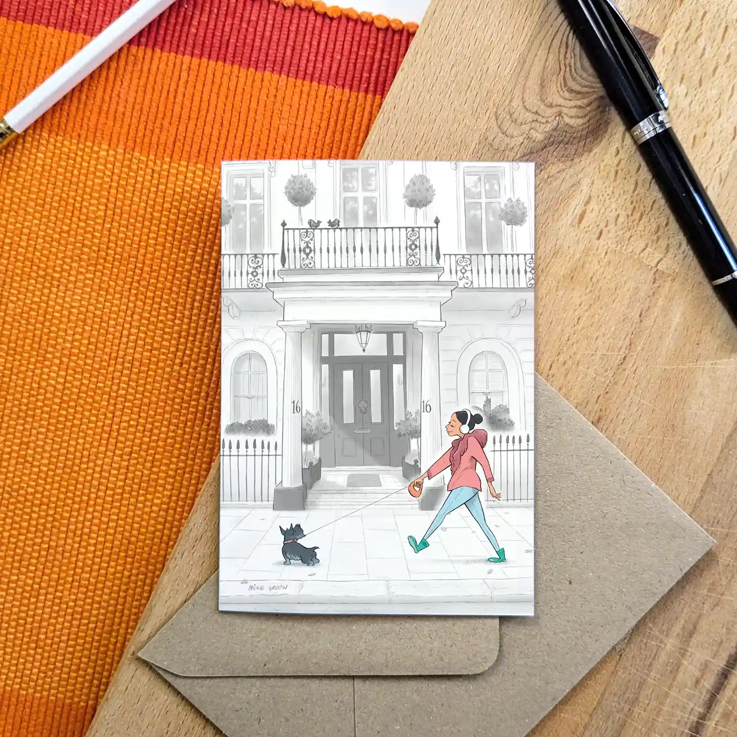 A lady and her terrier dog stroll through London Kensington in this beautifully illustrated greeting card by mike green illustration.