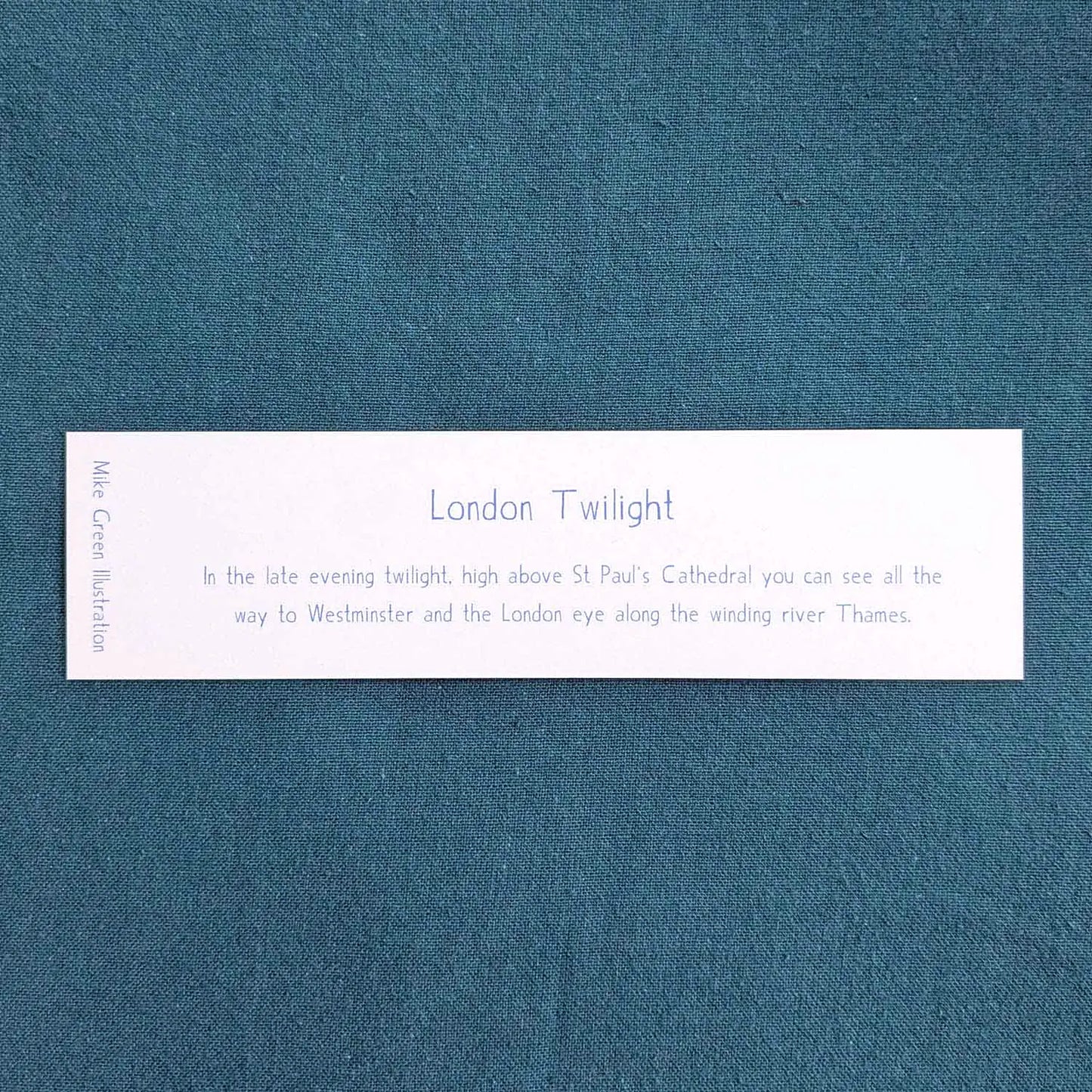 Back of a bookmark of London's skyline at night with St Paul's Cathedral and Big Ben