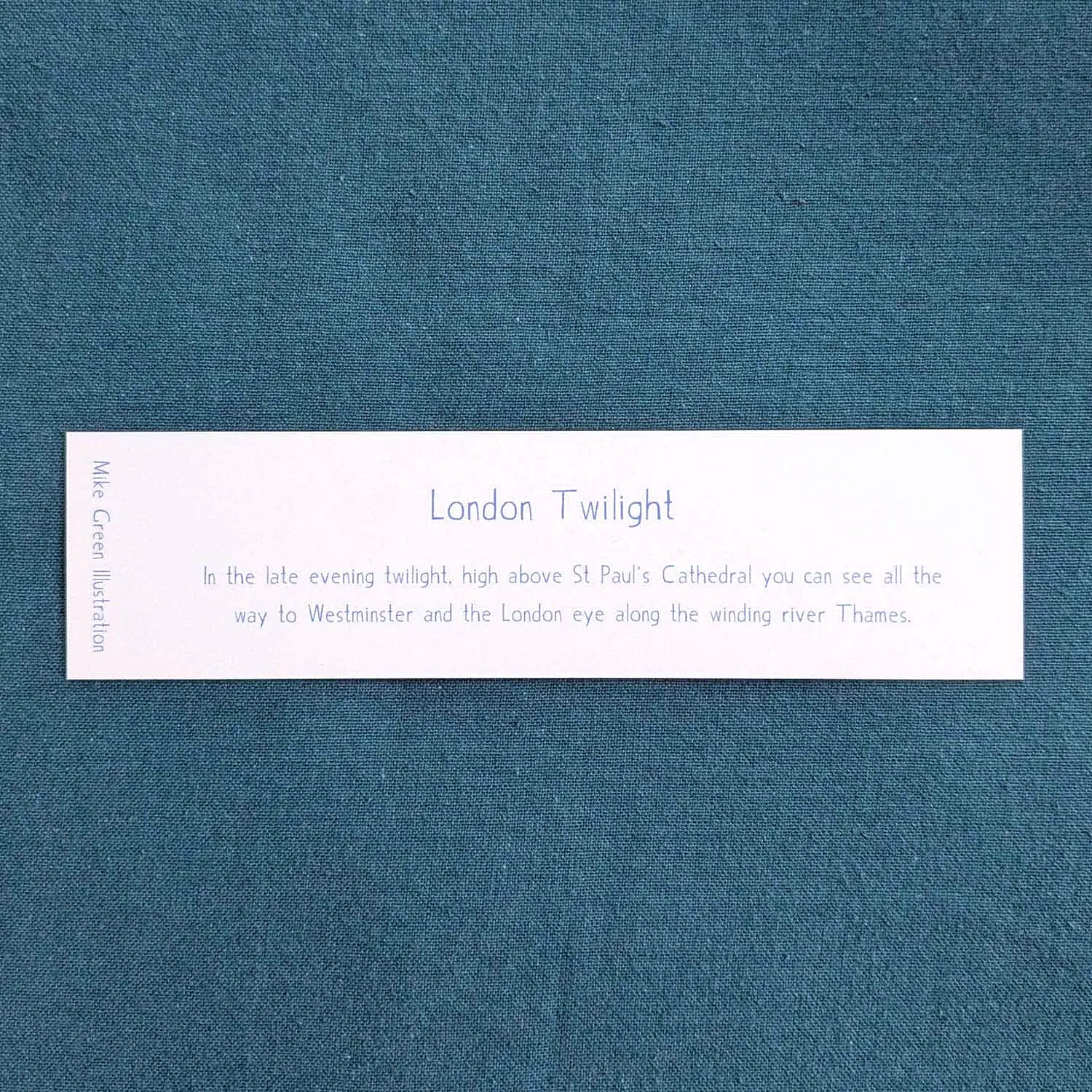Back of a bookmark of London's skyline at night with St Paul's Cathedral and Big Ben