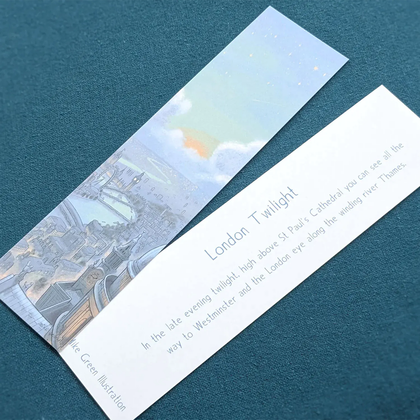 Front and back of a bookmark of London's skyline at night with St Paul's Cathedral and Big Ben