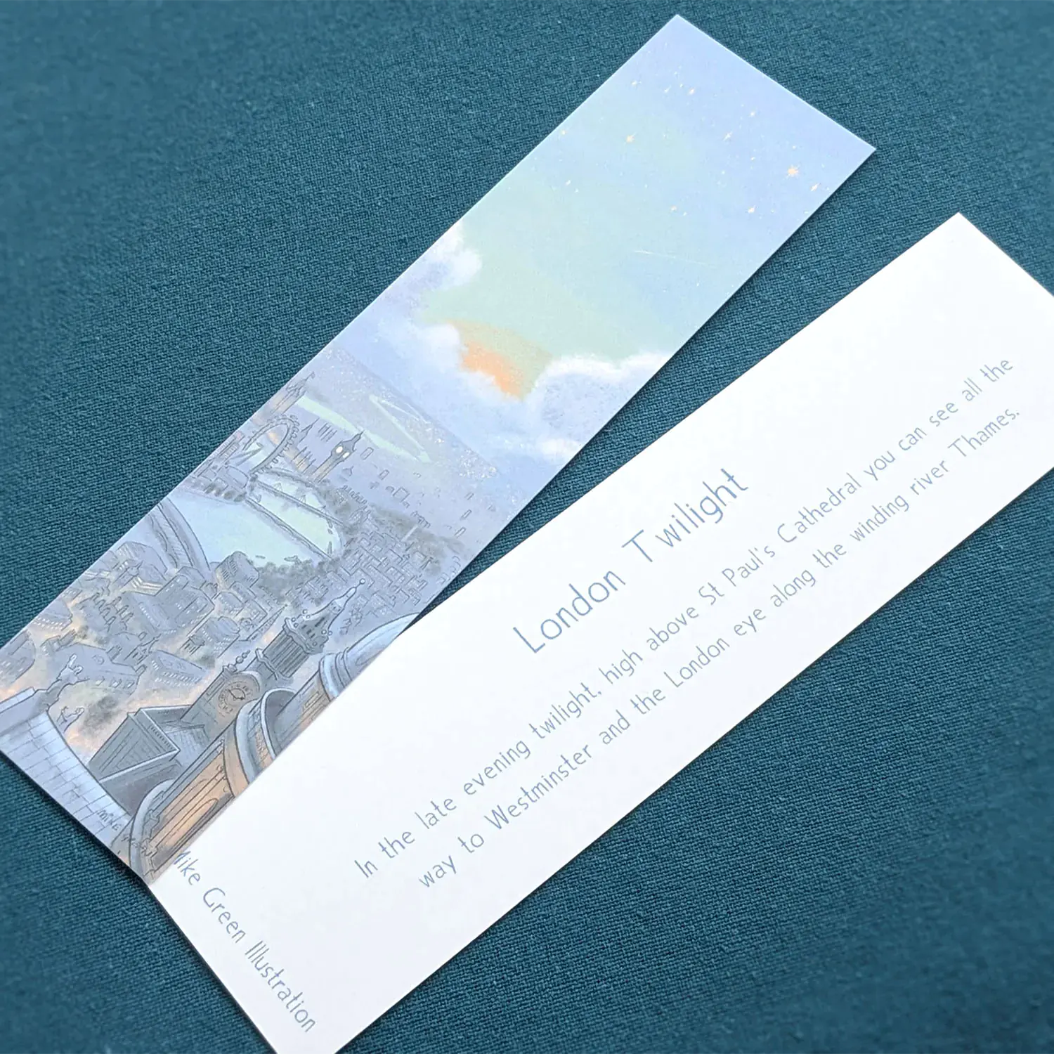Front and back of a bookmark of London's skyline at night with St Paul's Cathedral and Big Ben