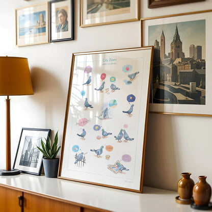 Framed art print of pigeons of London with city doves on a chest of drawers