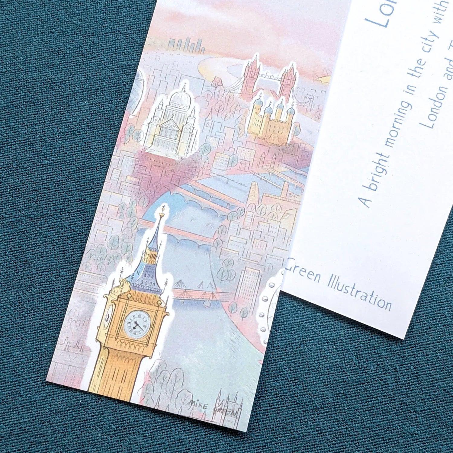 Close up of a London bookmark with landmarks in the sunshine including Big Ben, St Paul's Cathedral and Tower Bridge
