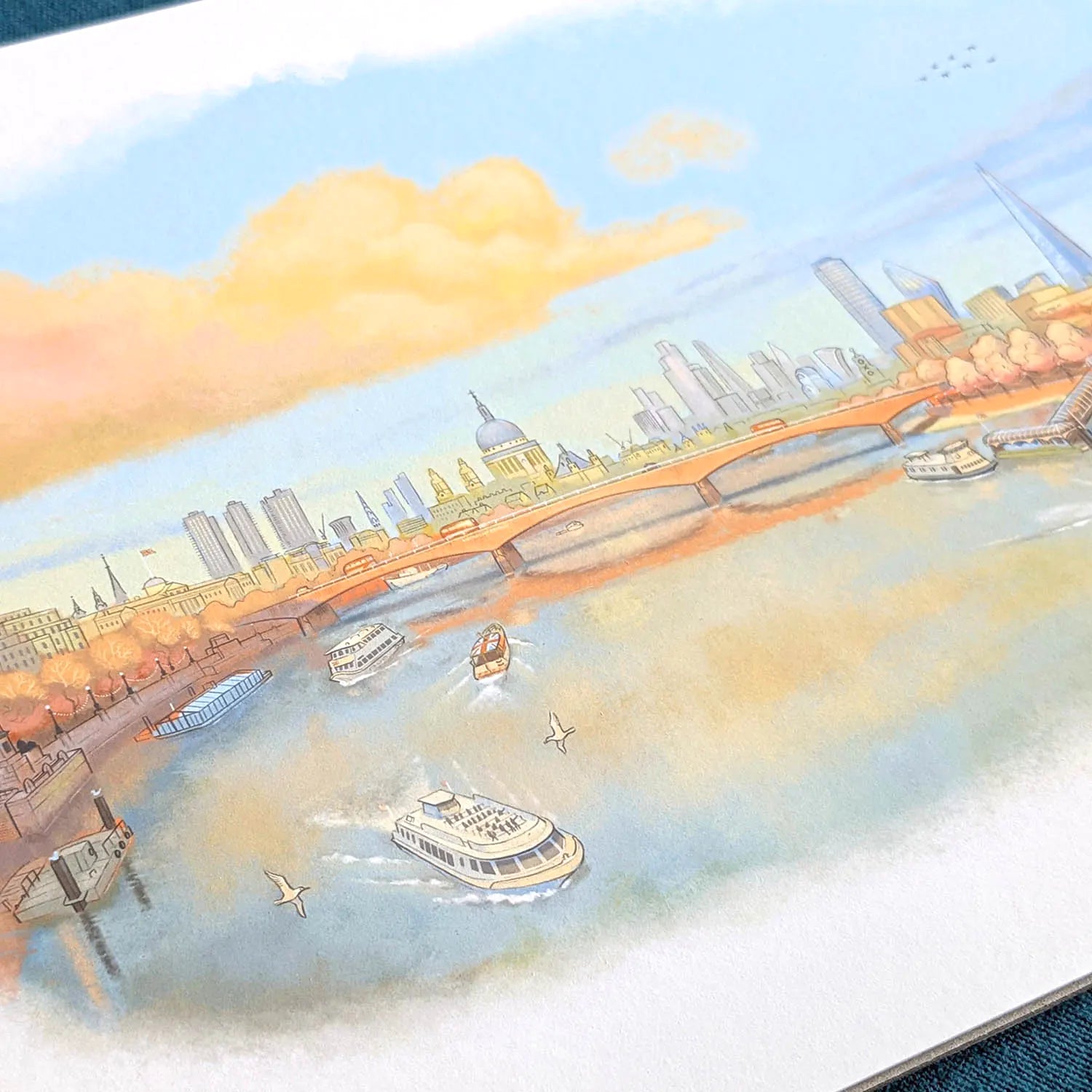 Close up photo of a wall art print of a painting of the Thames in a late evening sunset