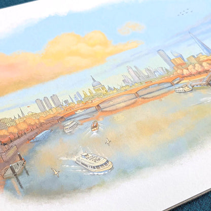 Close up photo of a wall art print of a painting of the Thames in a late evening sunset