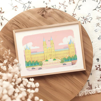 Framed wall art print of the Natural History Museum in London's South Kensington on a round table