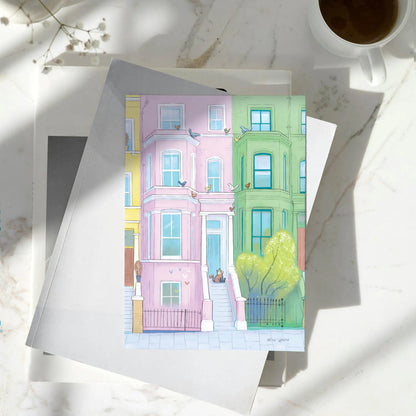 A greetings card with a lazy looking cat admiring some out of reach birds in London's Notting Hill
