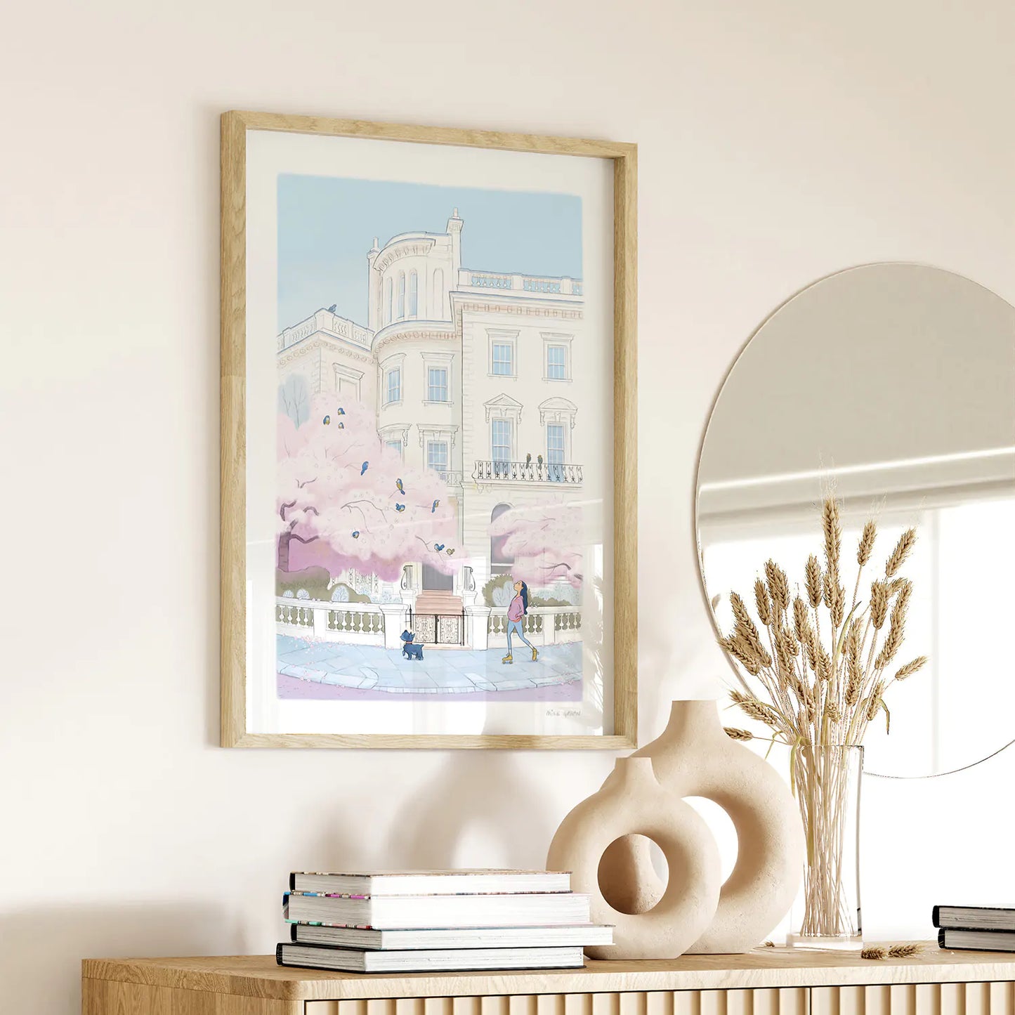 Framed print of a painting of a lady skating with her dog on a street in London's Notting Hill with a tree in blossom