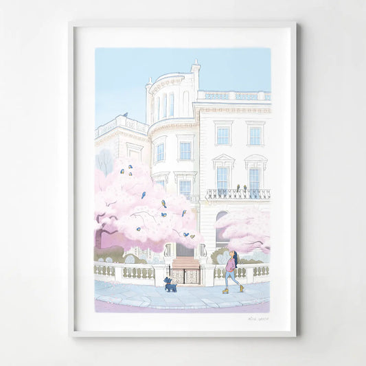 Framed print of a painting of a lady skating with her dog on a street in London's Notting Hill with a tree in blossom