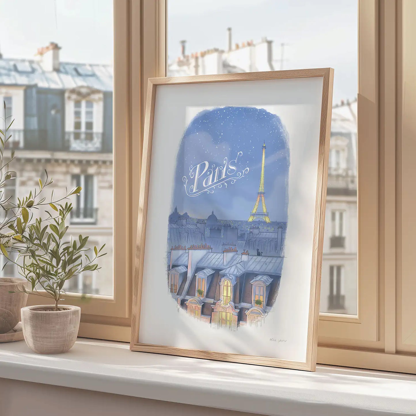 Framed print of an illustration of the Paris skyline at night with the Eifel Tower and the word Paris