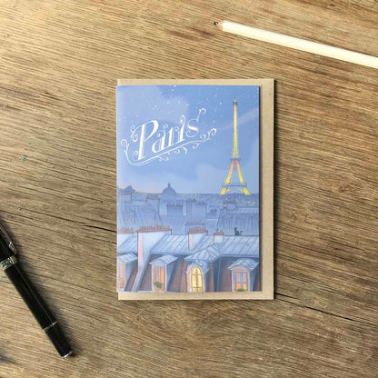 Paris night skyline with 'paris' title beautifully illustrated on a greeting card by mike green illustration.