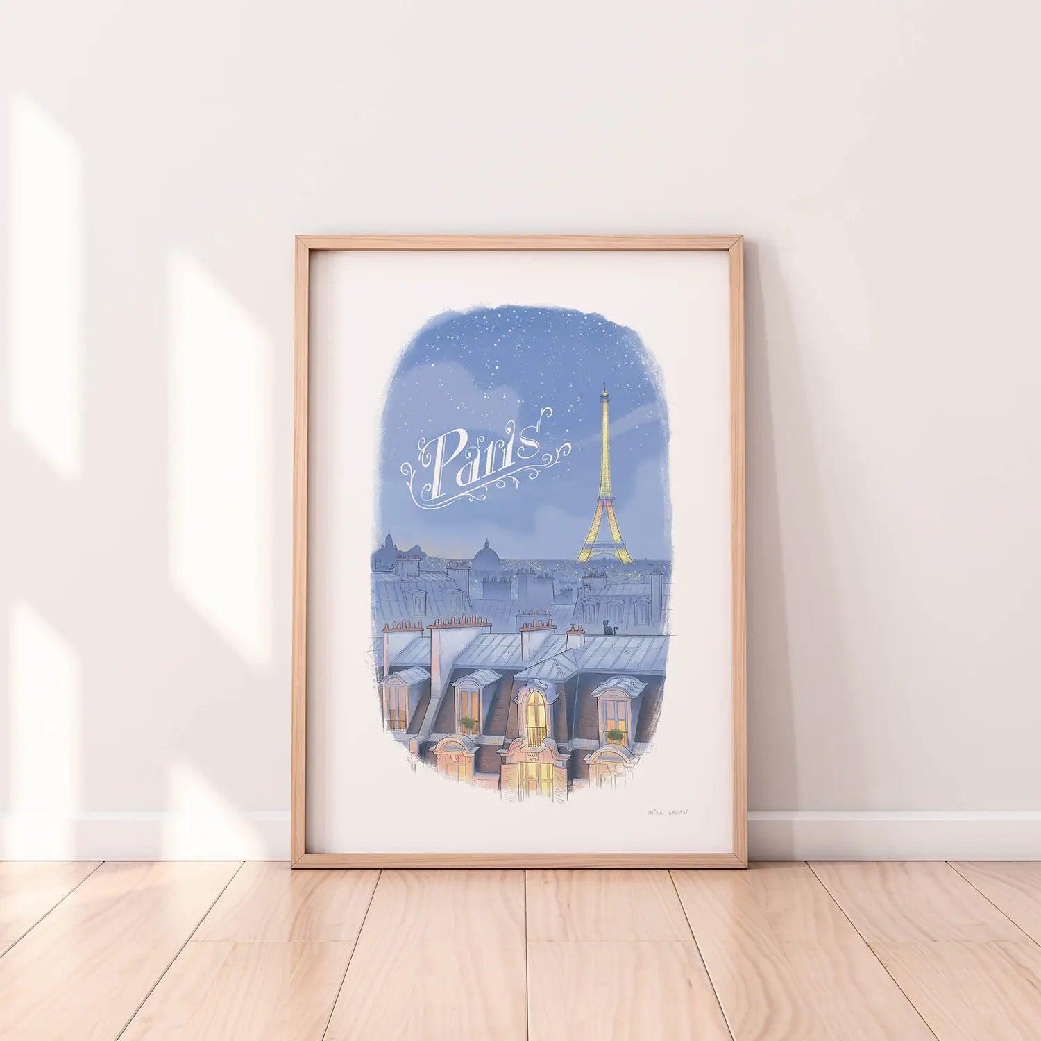 Framed print of an illustration of the Paris skyline at night with the Eifel Tower and the word Paris