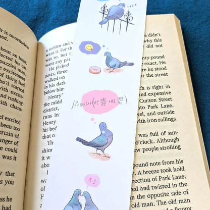 Bookmark with illustrations of pigeons on an open book